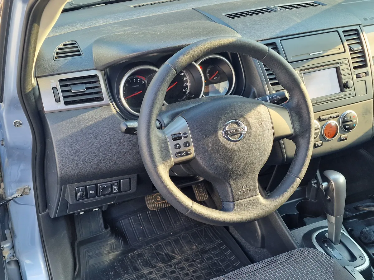 Nissan Tiida 1.6 AT (110 л.с.)