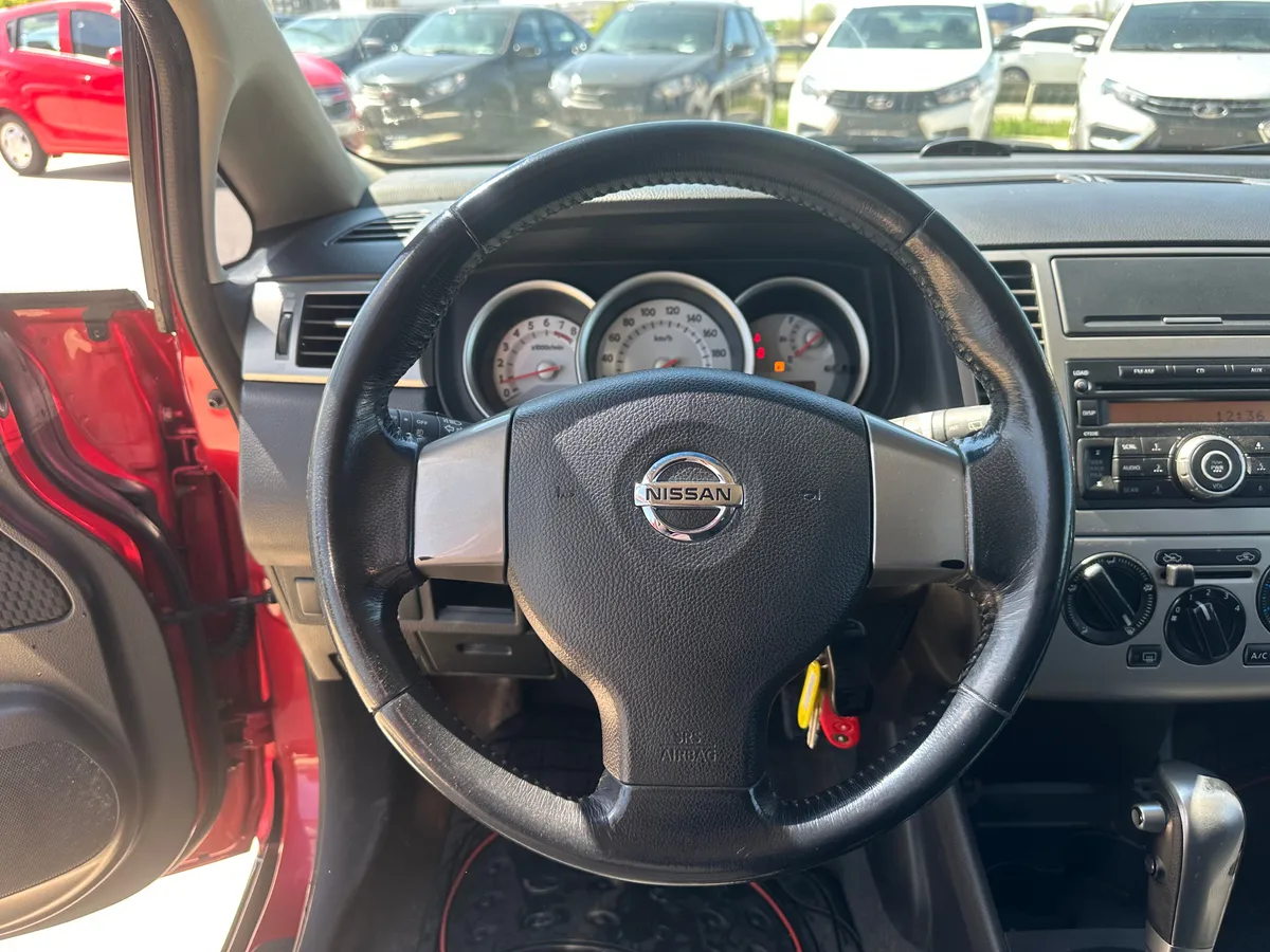 Nissan Tiida 1.6 AT (110 л.с.)