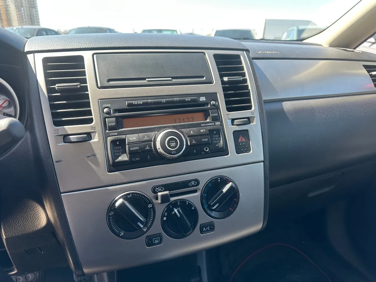 Nissan Tiida 1.6 AT (110 л.с.)