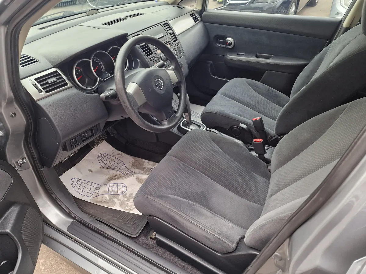 Nissan Tiida 1.6 AT (110 л.с.)