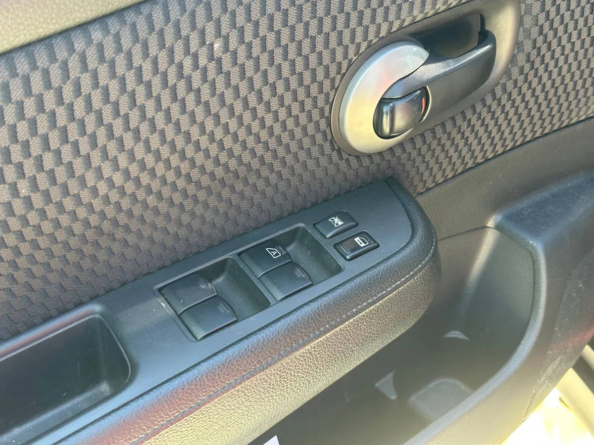 Nissan Tiida 1.6 AT (110 л.с.)