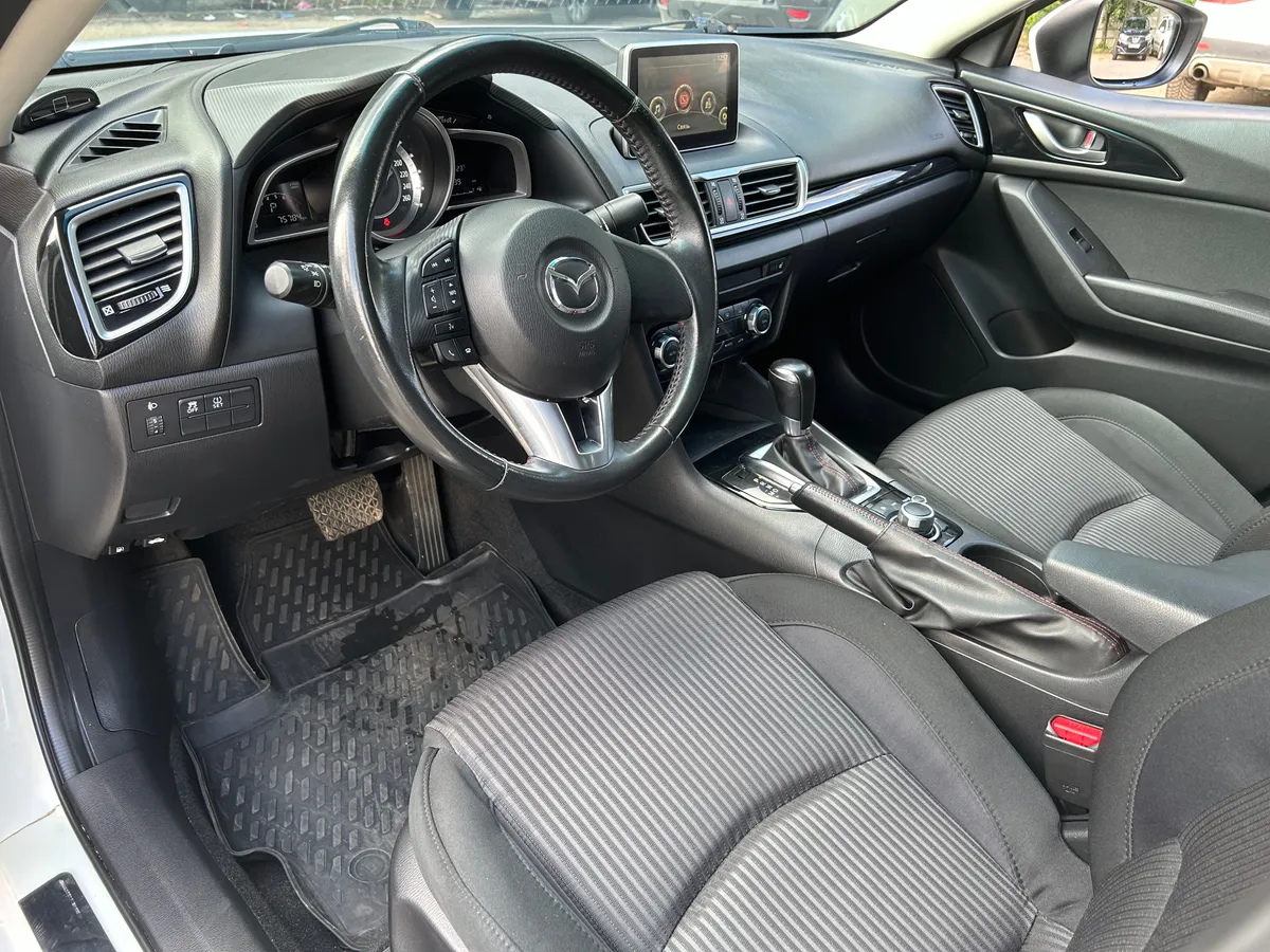 Mazda 3 1.6 AT (104 л.с.)