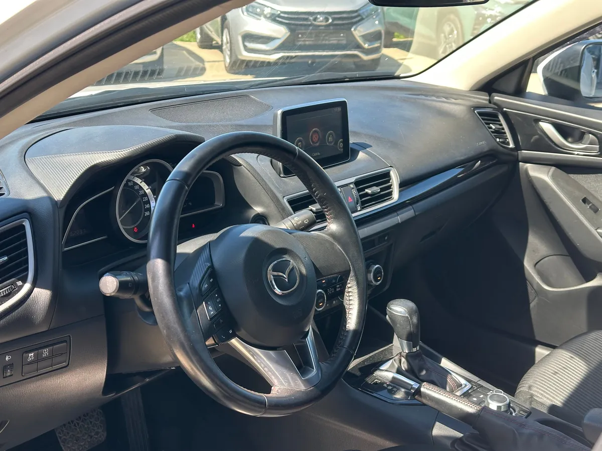 Mazda 3 1.6 AT (104 л.с.)