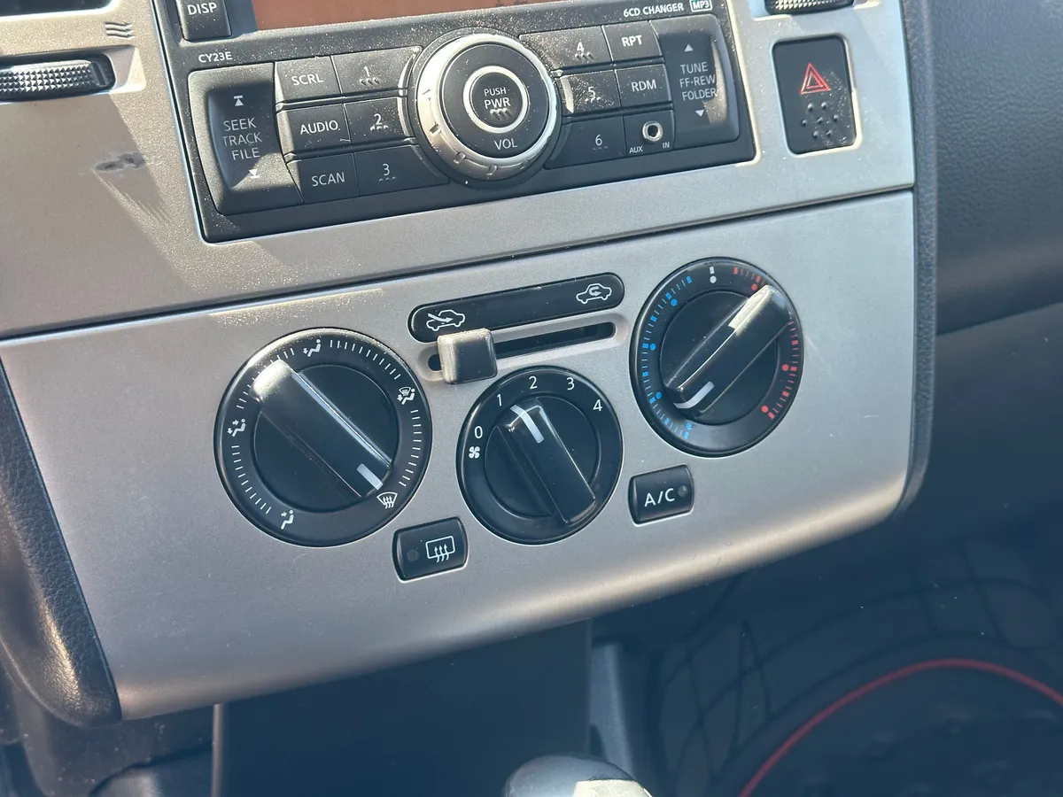 Nissan Tiida 1.6 AT (110 л.с.)